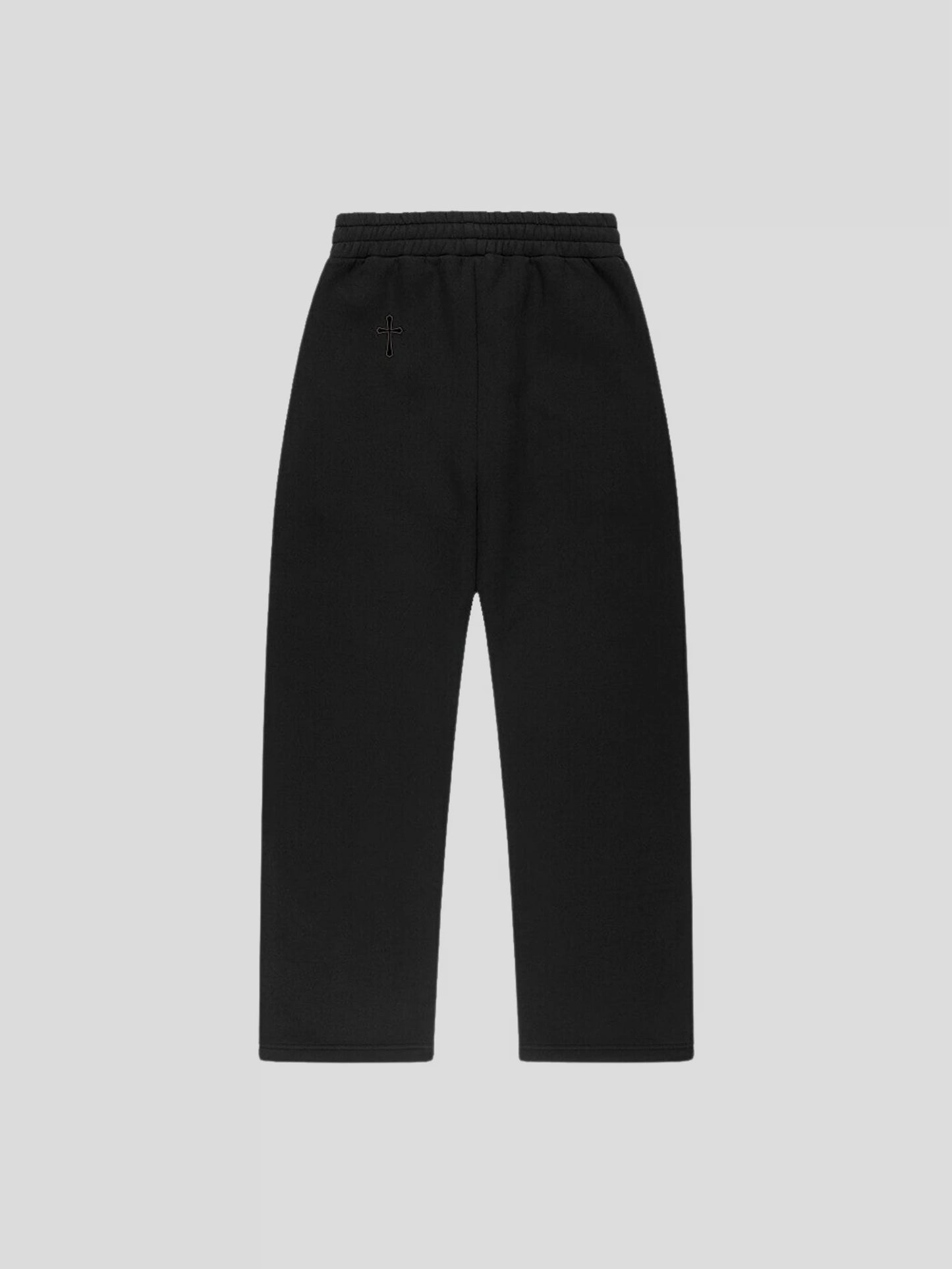 Back view of the black premium baggy jogger pants featuring MAXOMclo gothic cross logo and oversized relaxed fit.