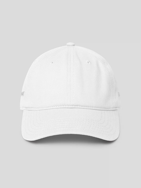 REMNANT. COLD CAP in white – minimalist low-profile streetwear baseball cap with subtle logo embroidery.