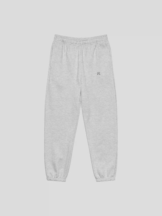 Front view of REMNANT. THEORY.01 SWEATS in COLD Grey – oversized heavyweight fleece streetwear sweatpants with minimalist logo
