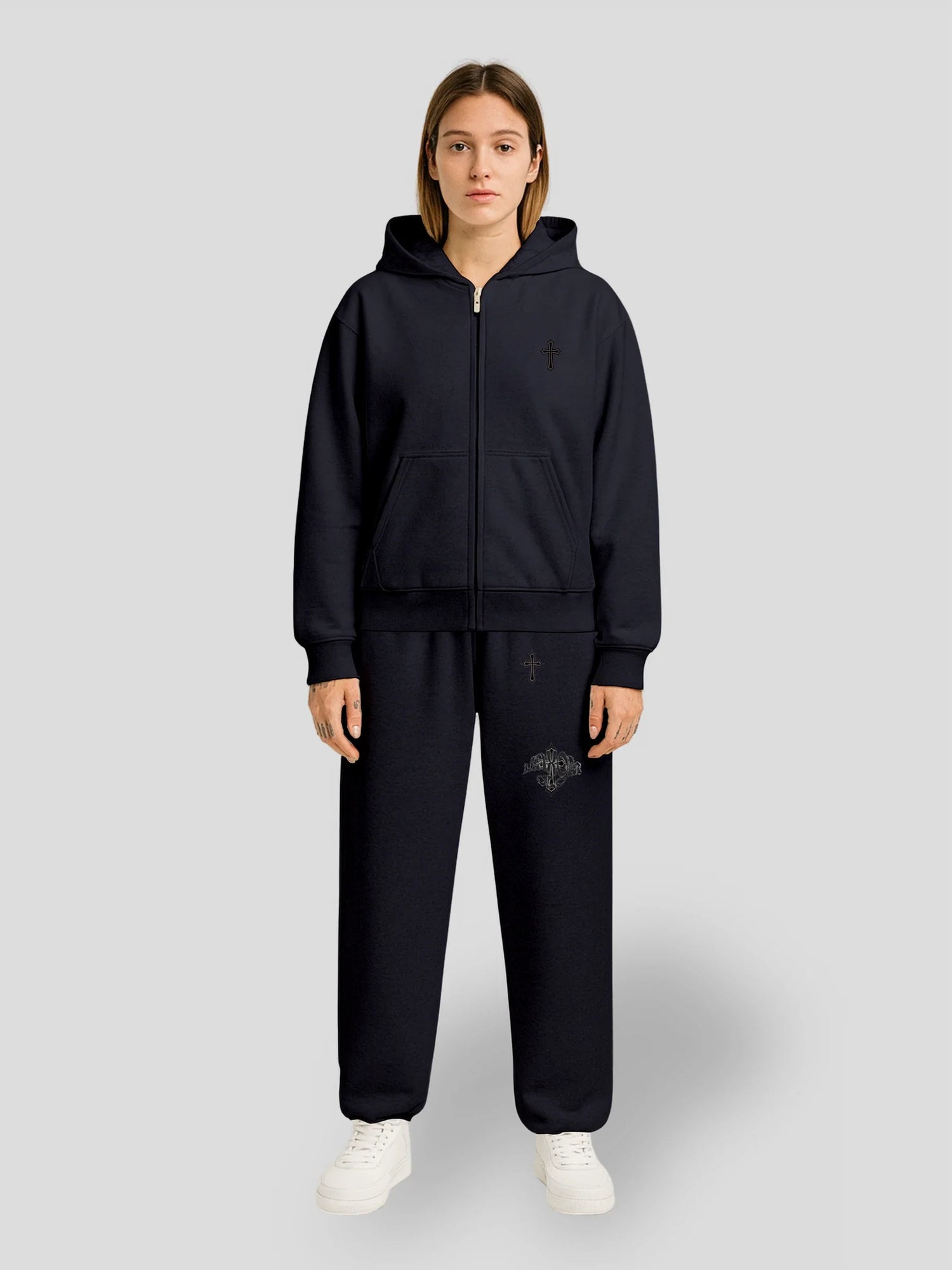 Model wearing navy oversized zipper hoodie and baggy sweatpants with subtle cross detailing — MAXOMclo ELYSIUM Collection