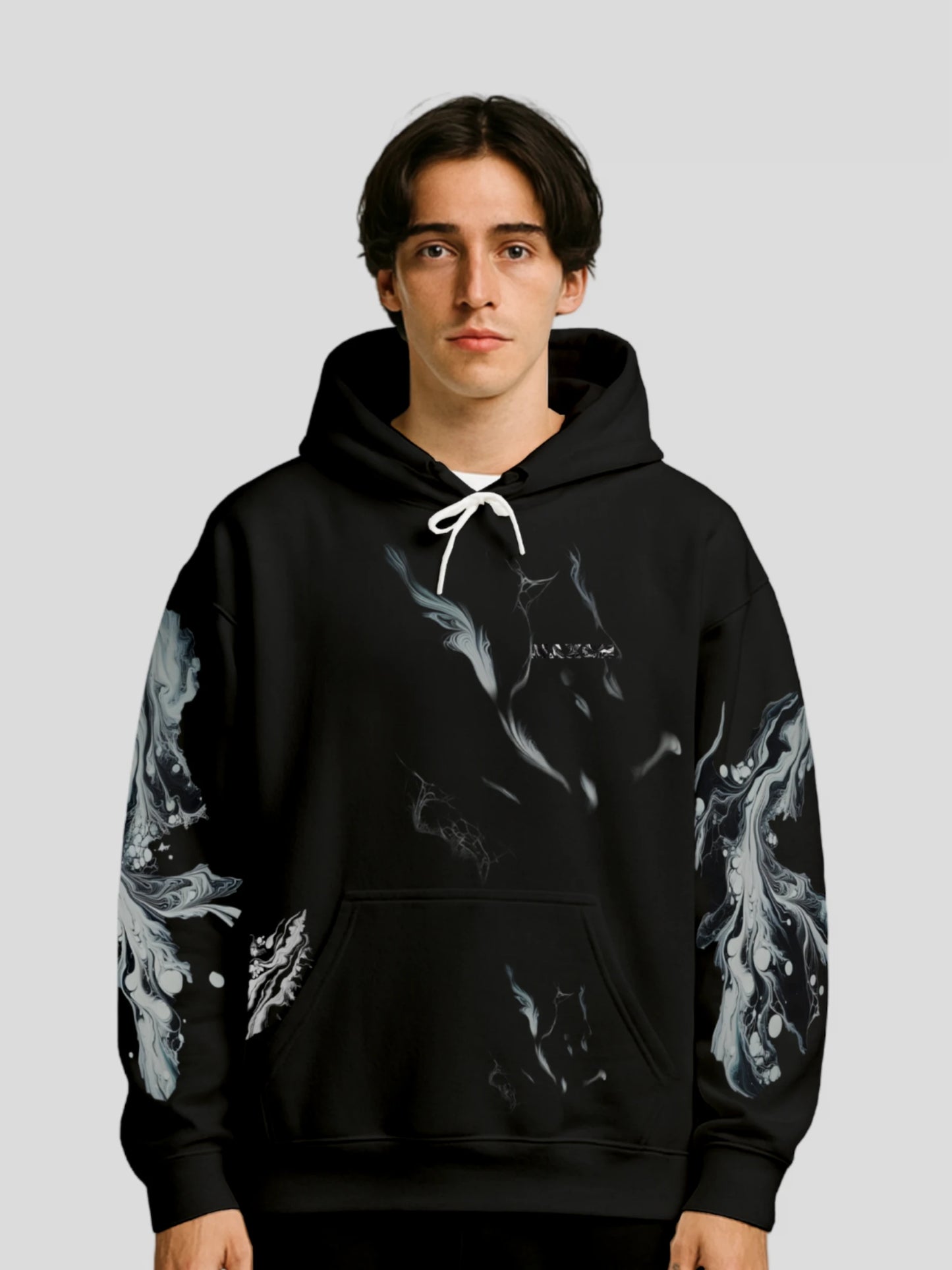 Model wearing the Luxury Streetwear Black Marble Hoodie by MAXOMclo – unisex black marble streetwear hoodie featuring bold marble print sleeves and minimalist logo design.