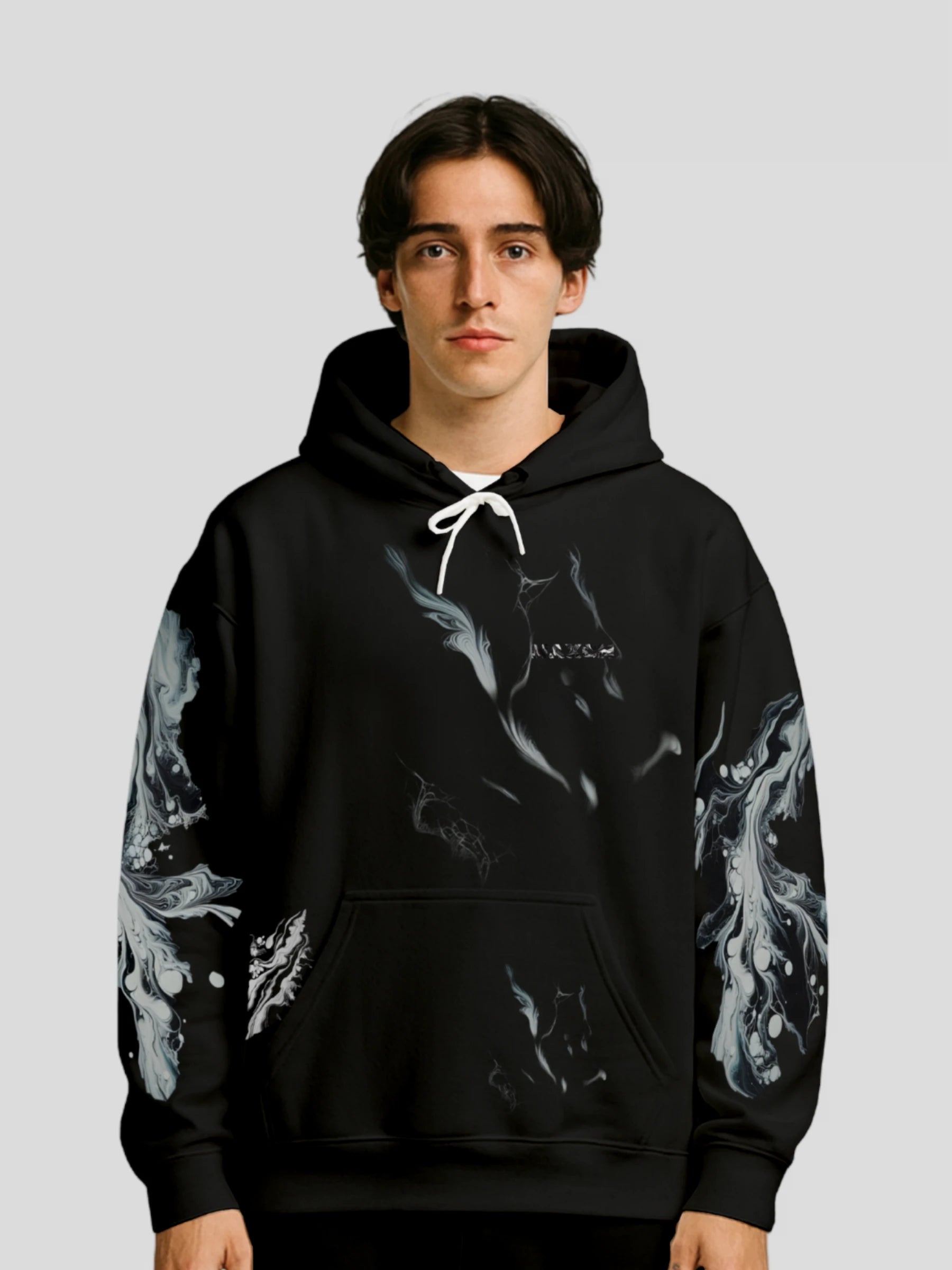 Model wearing the Luxury Streetwear Black Marble Hoodie by MAXOMclo – unisex black marble streetwear hoodie featuring bold marble print sleeves and minimalist logo design.