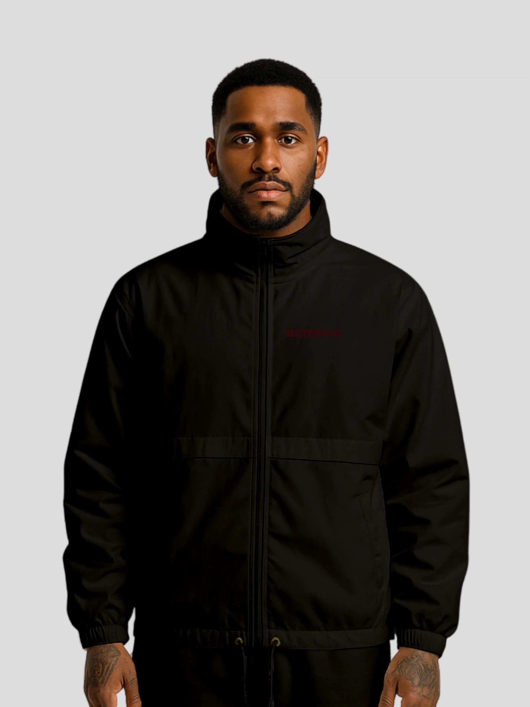 Male model wearing the black techwear windbreaker jacket by MAXOMclo – PETA-approved vegan streetwear windbreaker built for urban style and performance.