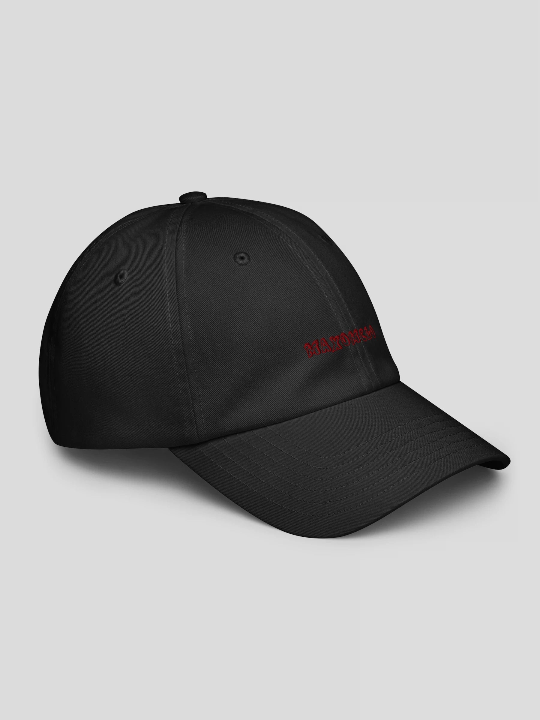 Right side view of the black luxury streetwear cap featuring embroidered MAXOMclo logo and low-profile structured fit.