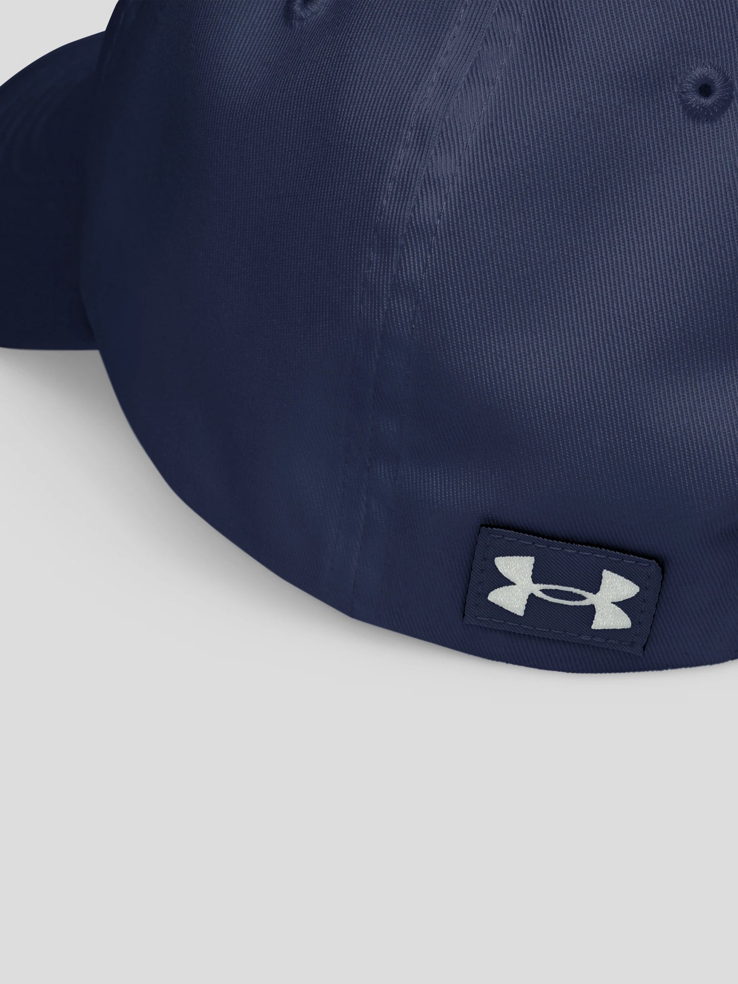 Detail shot of the luxury navy embroidered streetwear cap, showing premium craftsmanship and clean modern texture.