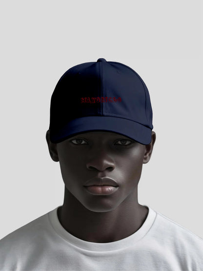 Model wearing the Crimson Stealth Unisex Baseball Cap by MAXOMclo – navy minimalist streetwear baseball cap with embroidered red MAXOMclo logo and urban luxury fit.