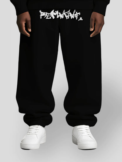 DROP.ØNE black oversized streetwear sweatpants with bold graffiti print – unisex 380 GSM heavyweight fleece joggers designed for mindset-driven urban fashion with relaxed baggy fit
