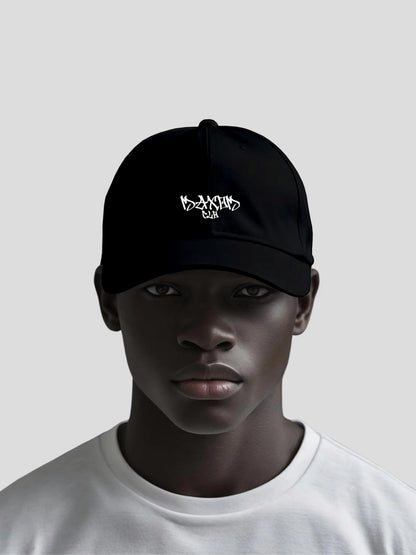 Male model wearing the ECHO Black Low-Profile Streetwear Baseball Cap by MAXOMclo – premium minimalist streetwear cap made from 100% cotton twill.