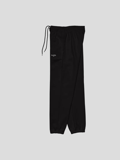 Left side angle of MAXOMclo black baggy joggers