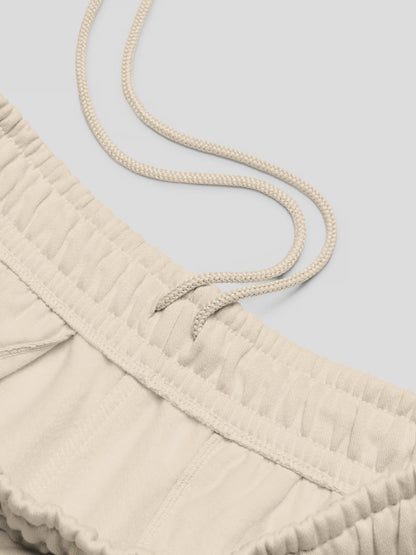 Drawstring detail of ECHO dust beige cotton joggers