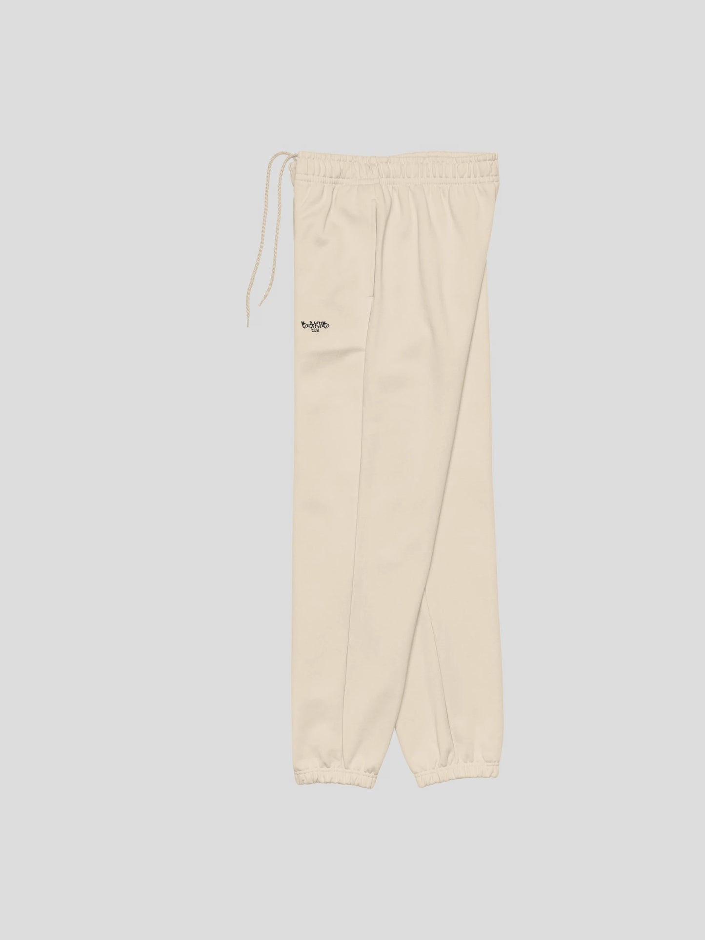 Side view of ECHO beige baggy joggers from MAXOMclo