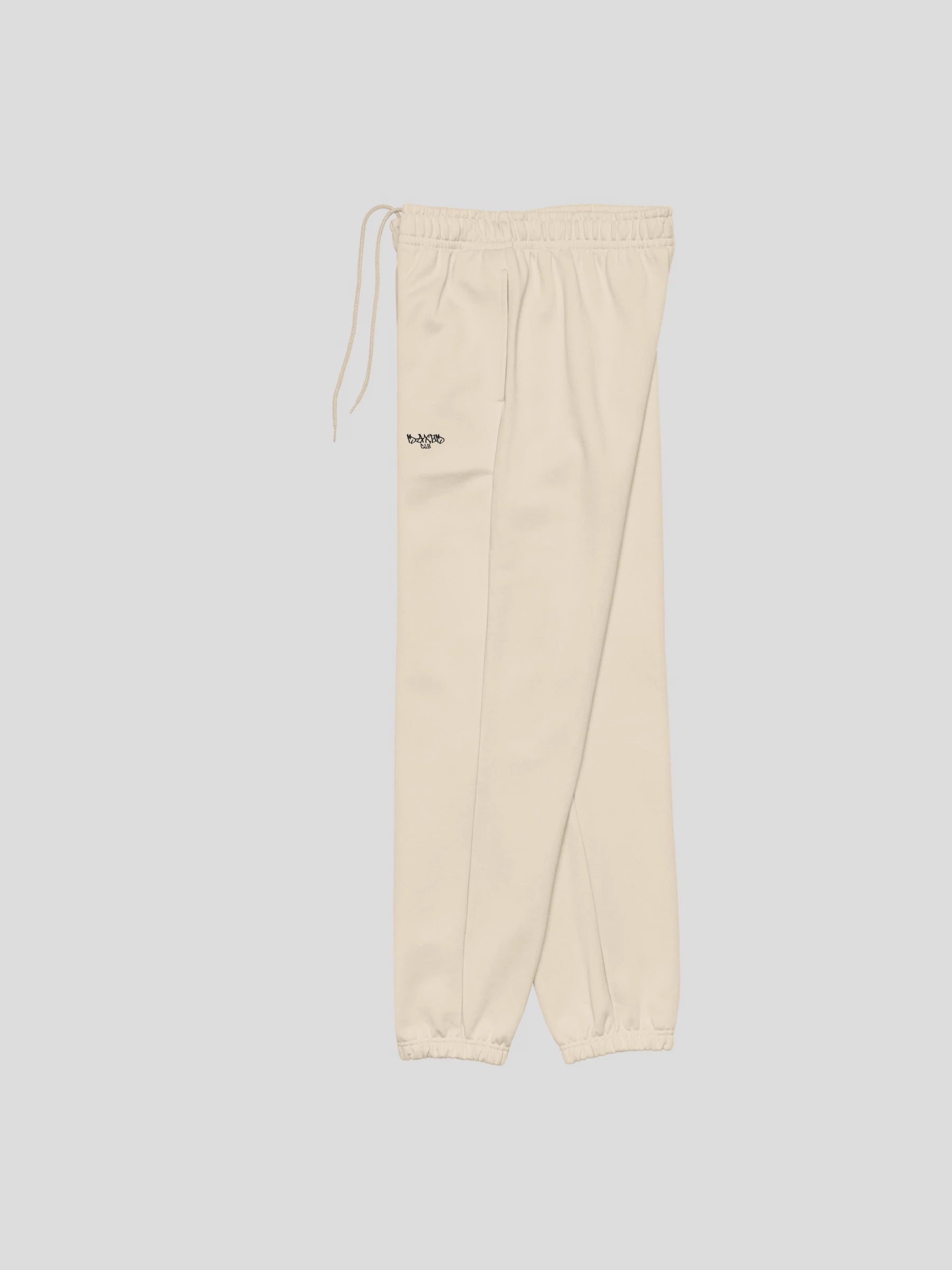 Side view of ECHO beige baggy joggers from MAXOMclo