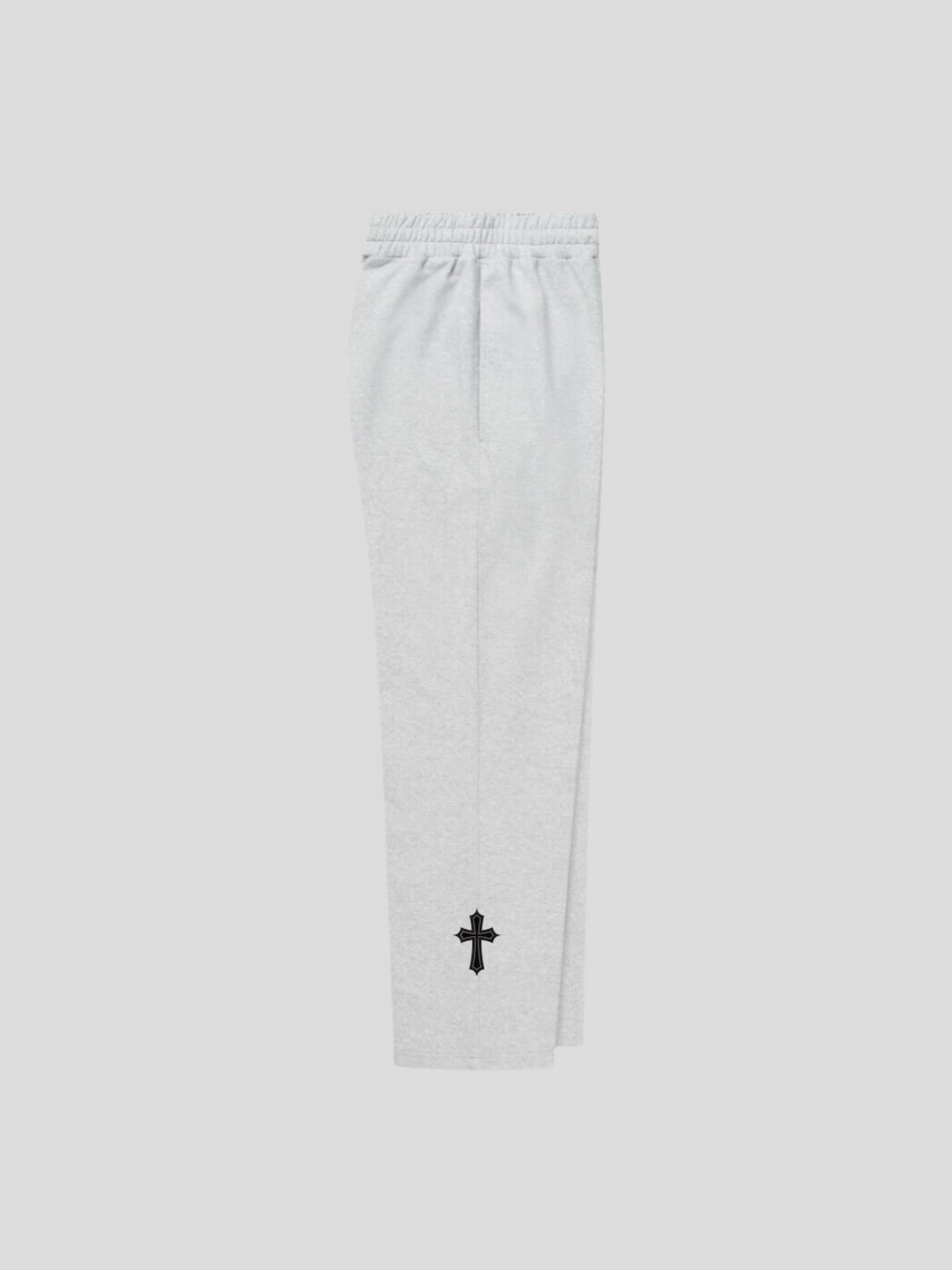 Right side view of the grey unisex baggy streetwear sweatpants by MAXOMclo – luxury oversized joggers with gothic cross embroidery.