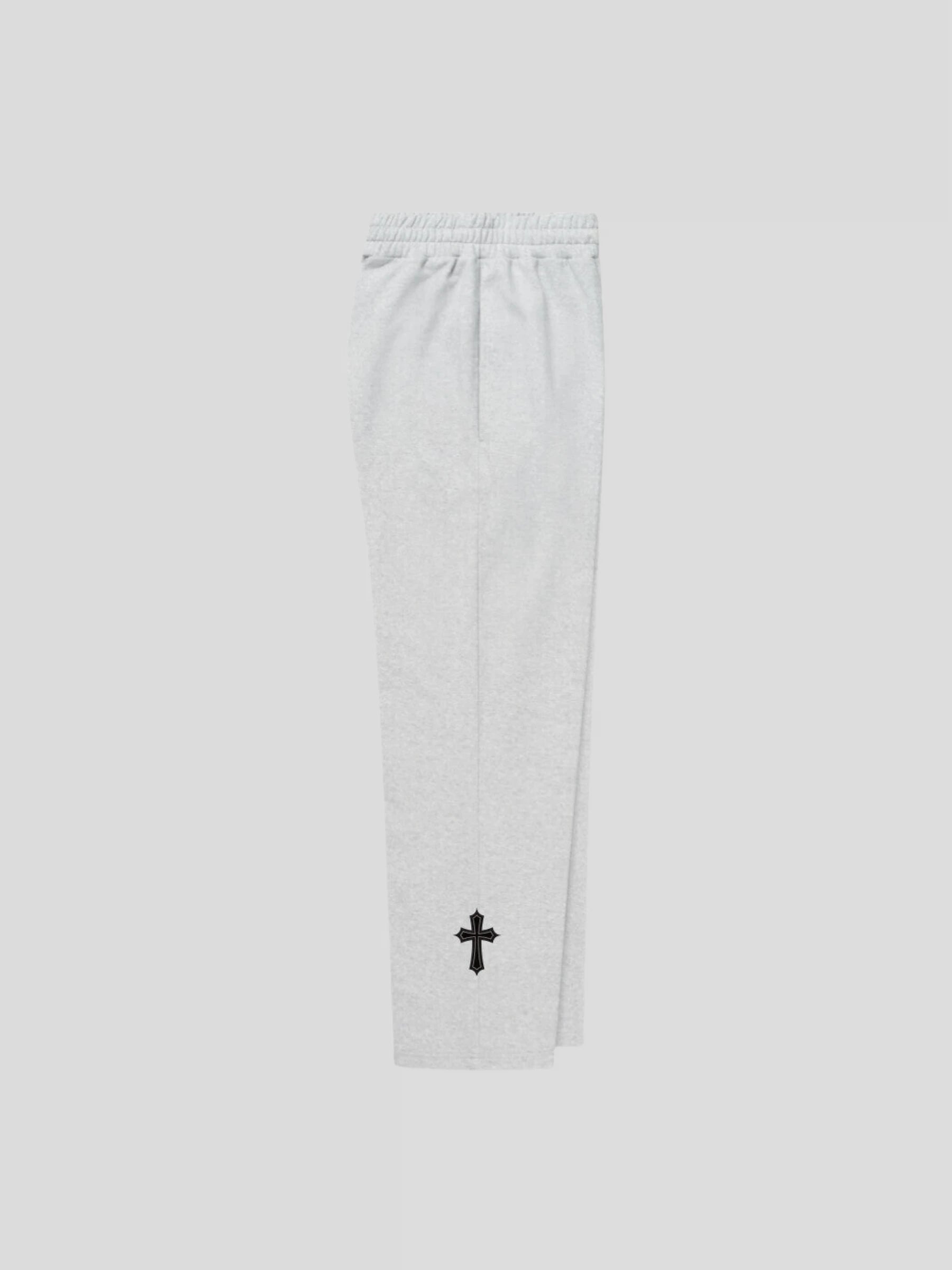 Right side view of the grey unisex baggy streetwear sweatpants by MAXOMclo – luxury oversized joggers with gothic cross embroidery.