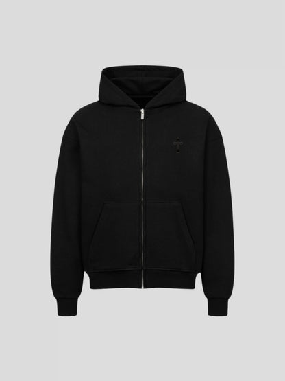 Front view of the black heavyweight oversized zip-up hoodie with tonal cross embroidery and minimalist design.