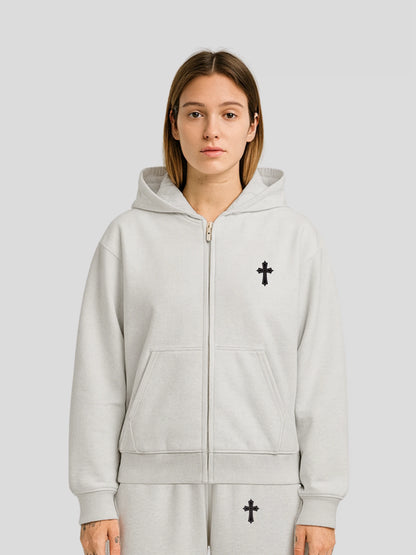 Model wearing the ELYSIUM Oversized Zipper Hoodie in Grey by MAXOMclo – 430 GSM heavyweight cotton streetwear hoodie with embroidered cross chest design.