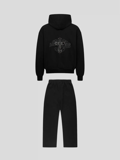 Back view of the MAXOMclo Elysium Tracksuit BLACK – luxury unisex oversized hoodie and jogger set in heavyweight cotton with black embroidered cross and gothic MAXOMclo logo.