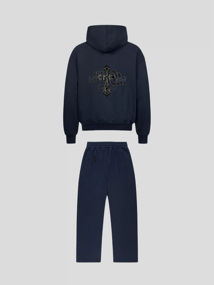 Back view of the MAXOMclo Elysium Tracksuit in Navy Blue – luxury oversized unisex hoodie and jogger set with black cross and gothic logo embroidery.