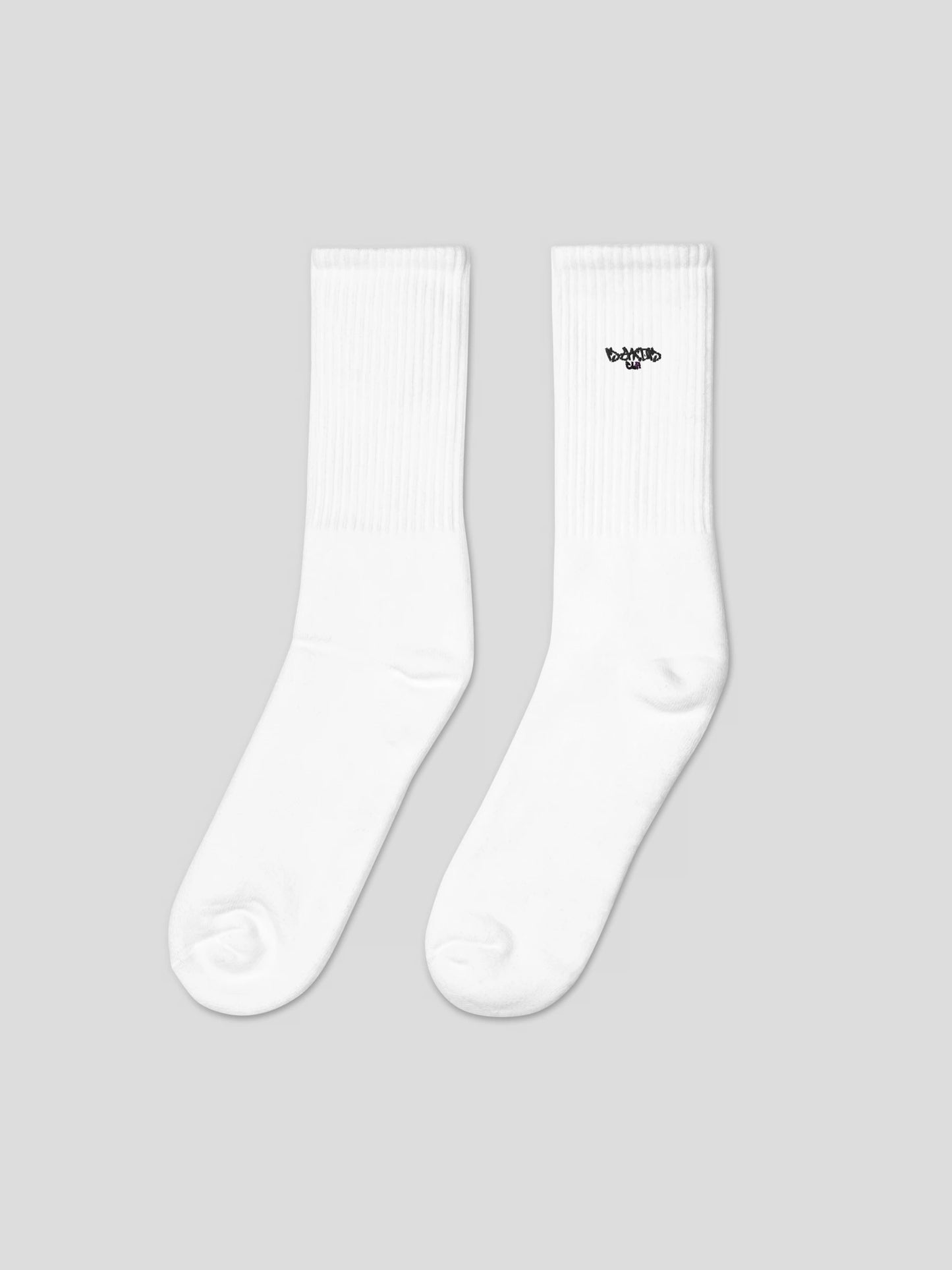 Left side angle of MAXOMclo ECHO Socks – soft white cotton streetwear socks with minimalist embroidery made in USA