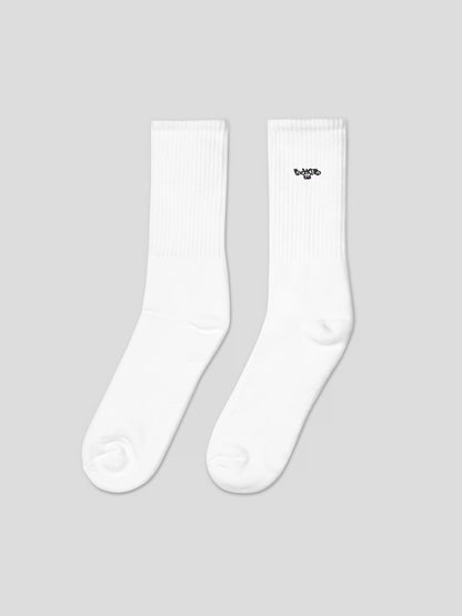 Left side angle of MAXOMclo ECHO Socks – soft white cotton streetwear socks with minimalist embroidery made in USA