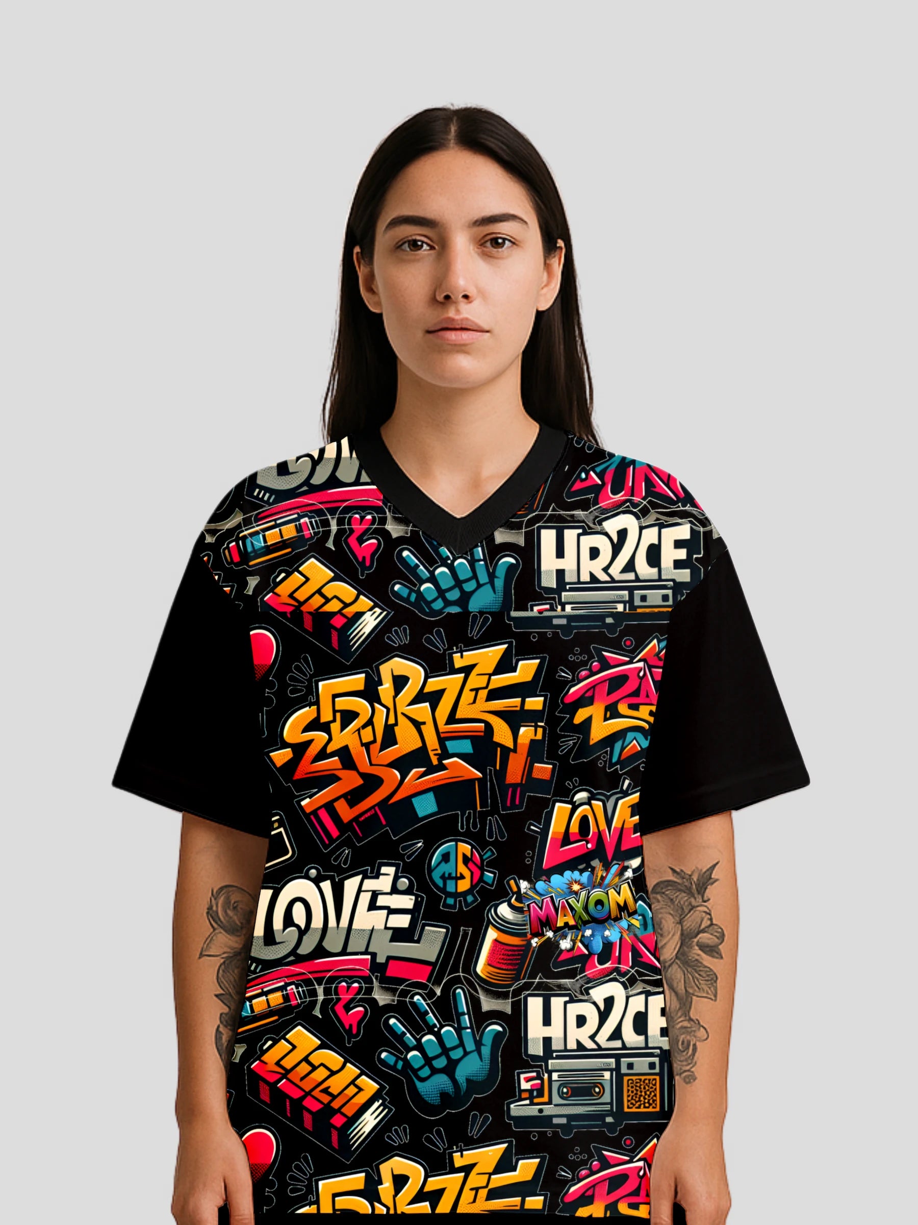 Model wearing the Oversized Streetwear Graphic Tee by MAXOMclo – a vibrant graffiti streetwear shirt with bold all-over print, 90s graffiti style, and oversized hip-hop streetwear fit.
