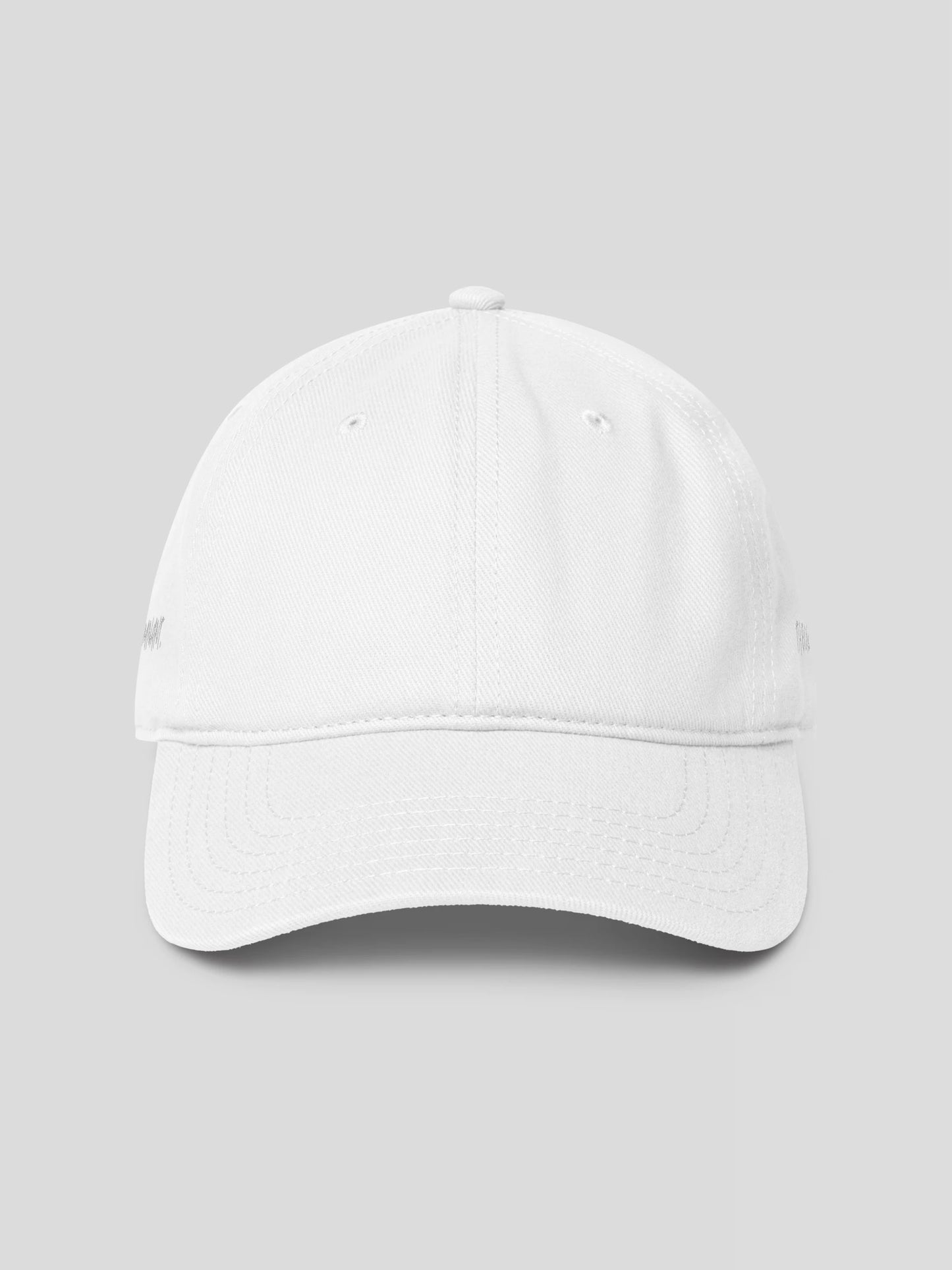 REMNANT. COLD CAP in white – minimalist low-profile streetwear baseball cap with subtle logo embroidery.