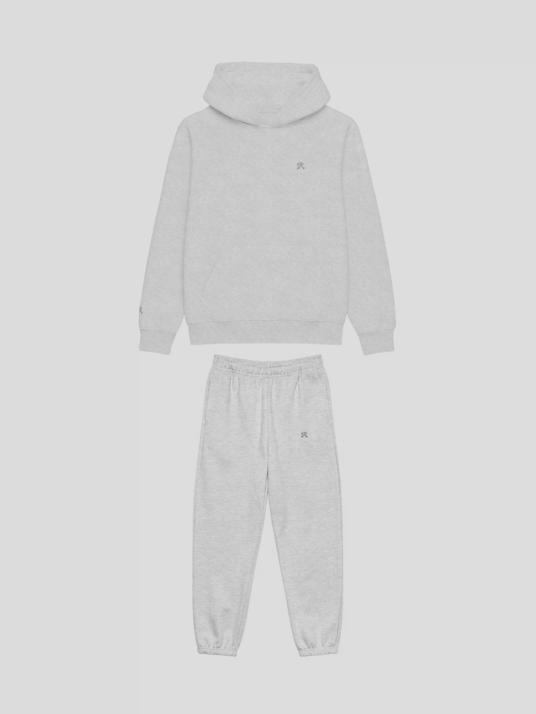 Front view of REMNANT. COLD THEORY.01 grey oversized hoodie and sweatpants set – clean minimalist streetwear design with embroidered logo