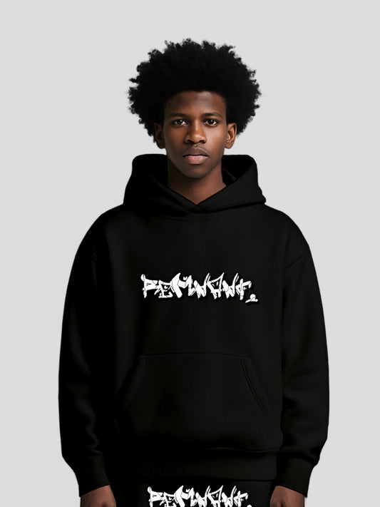 Model wearing the DROP.ØNE REMNANT. Hoodie in black – oversized 380 GSM graffiti streetwear hoodie by MAXOMclo