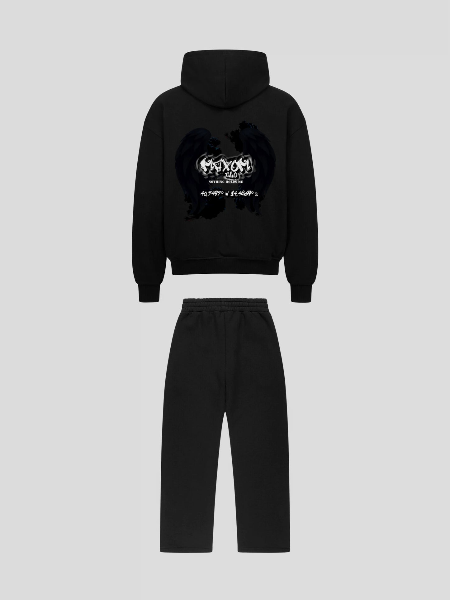 Back view of REMNANT ECLIPSE_R0 black streetwear set featuring angel wing graphic and Nothing Holds Me quote by MAXOMclo