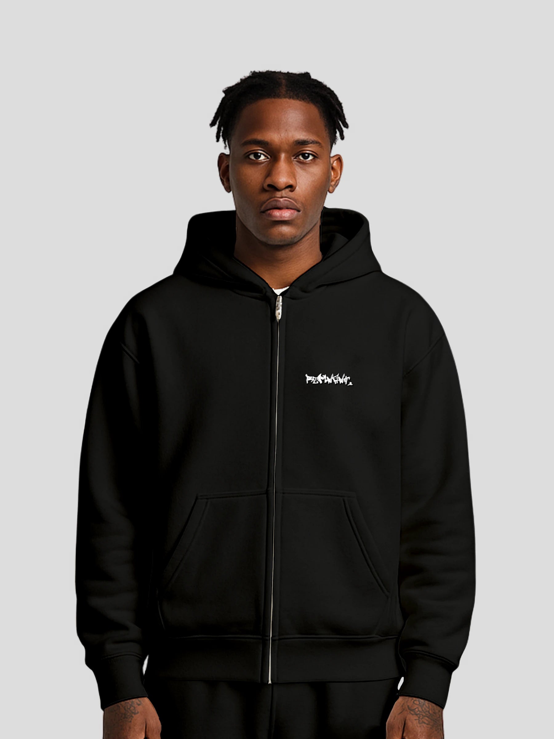 Model wearing REMNANT. ECLIPSE_R0 Oversized Zipper Hoodie in black – luxury heavyweight streetwear look