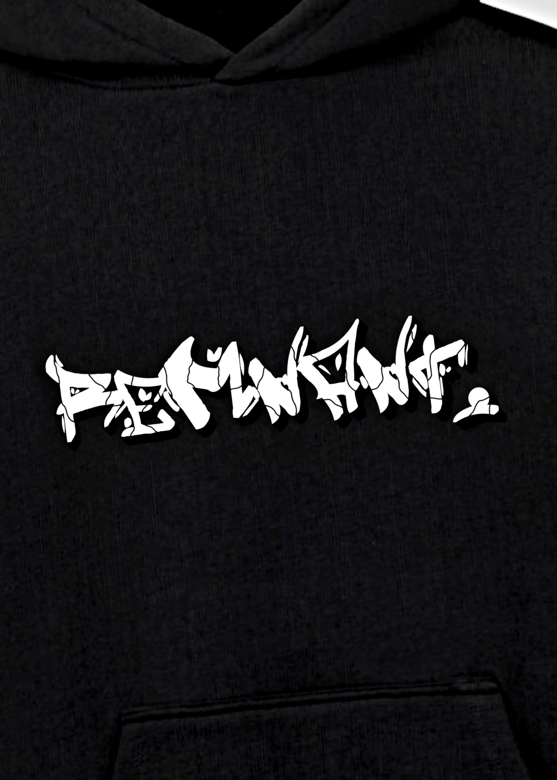 Close-up of graffiti-style REMNANT. logo on oversized black urban streetwear hoodie – mindset-driven statement design.