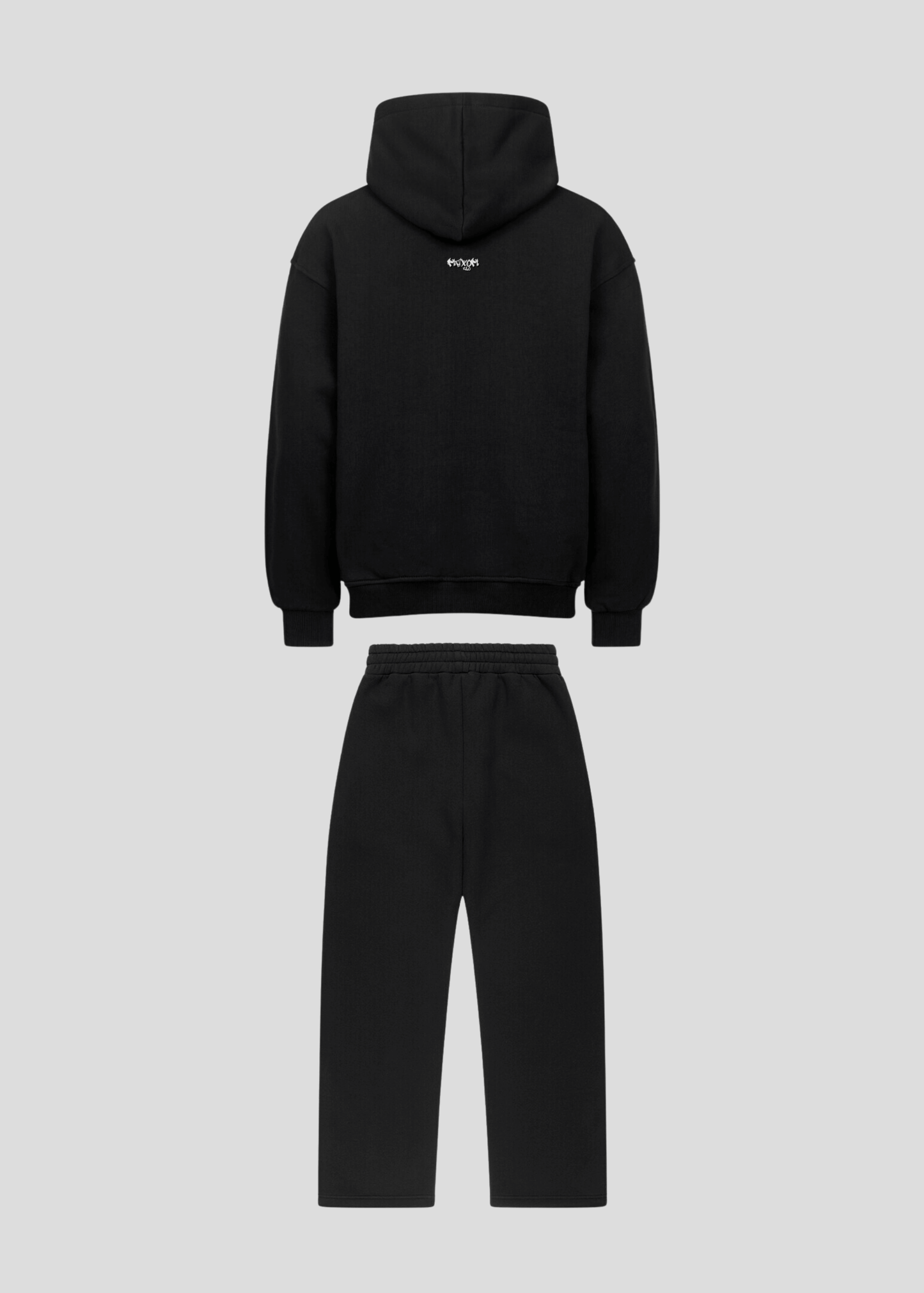 Back flatlay of black oversized graffiti hoodie and sweatpants set
