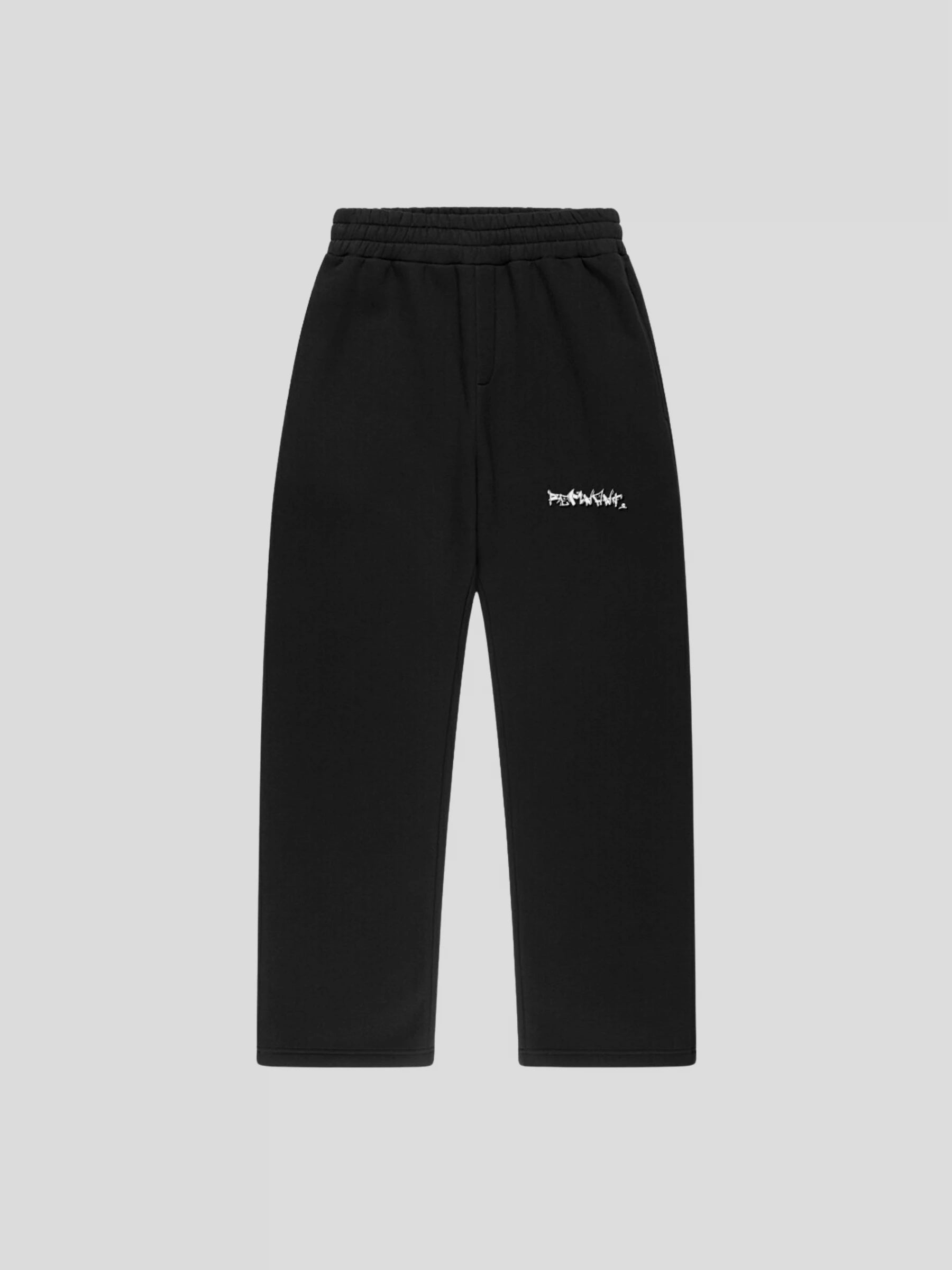 Front view of REMNANT. LIMITED black streetwear sweatpants with REMNANT. logo print on thigh