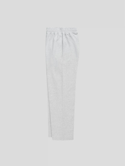 Left side view of REMNANT. LIMITED grey streetwear sweatpants with clean oversized fit