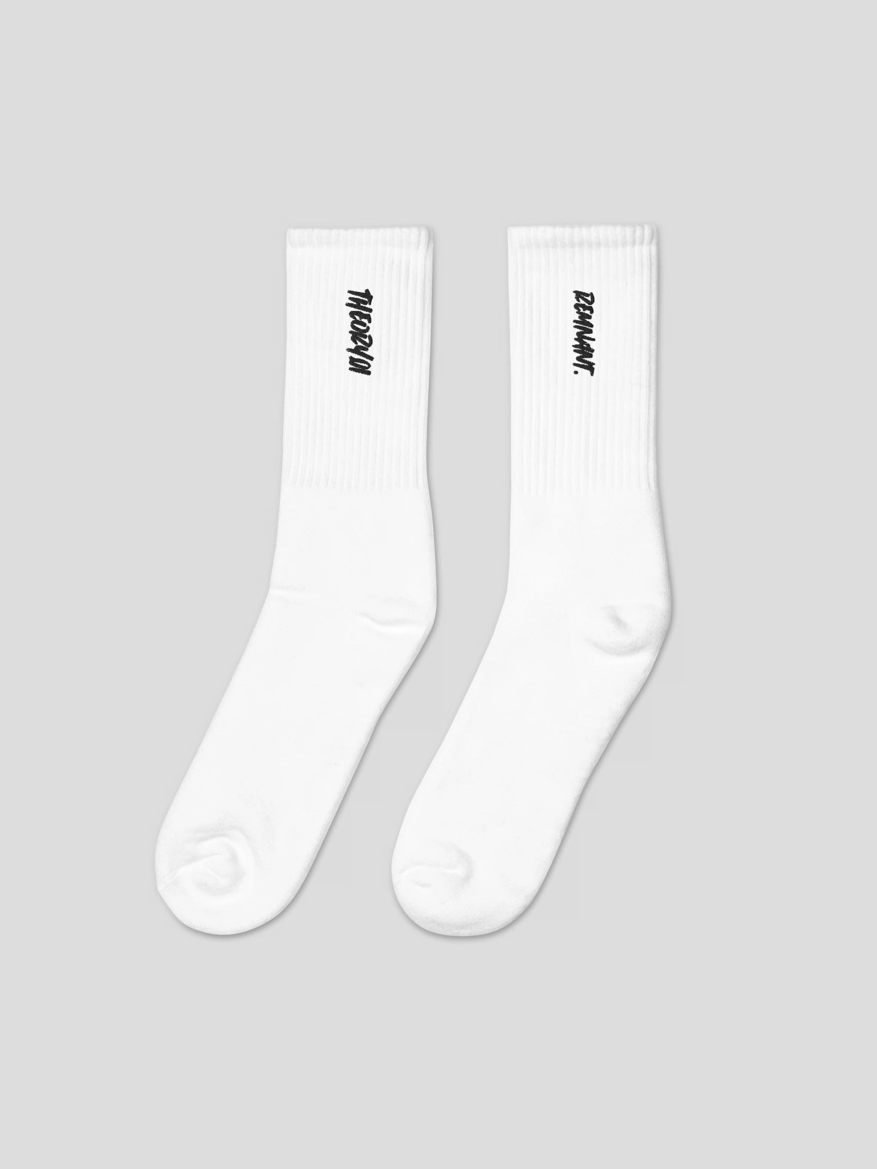 Front view of REMNANT. THEORY101 black socks – minimalist embroidered streetwear design