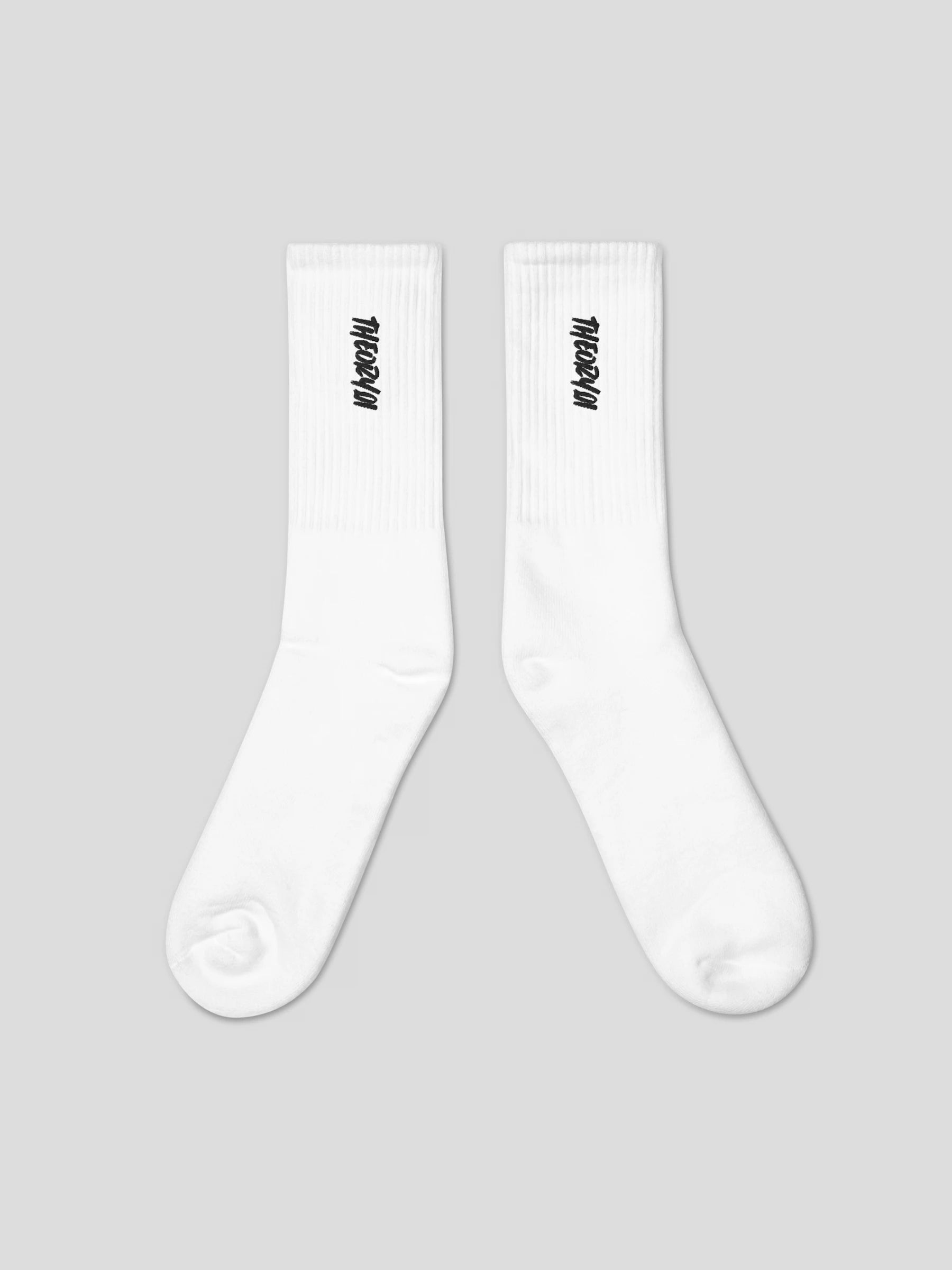 Close-up of THEORY01 logo embroidery on black premium streetwear socks