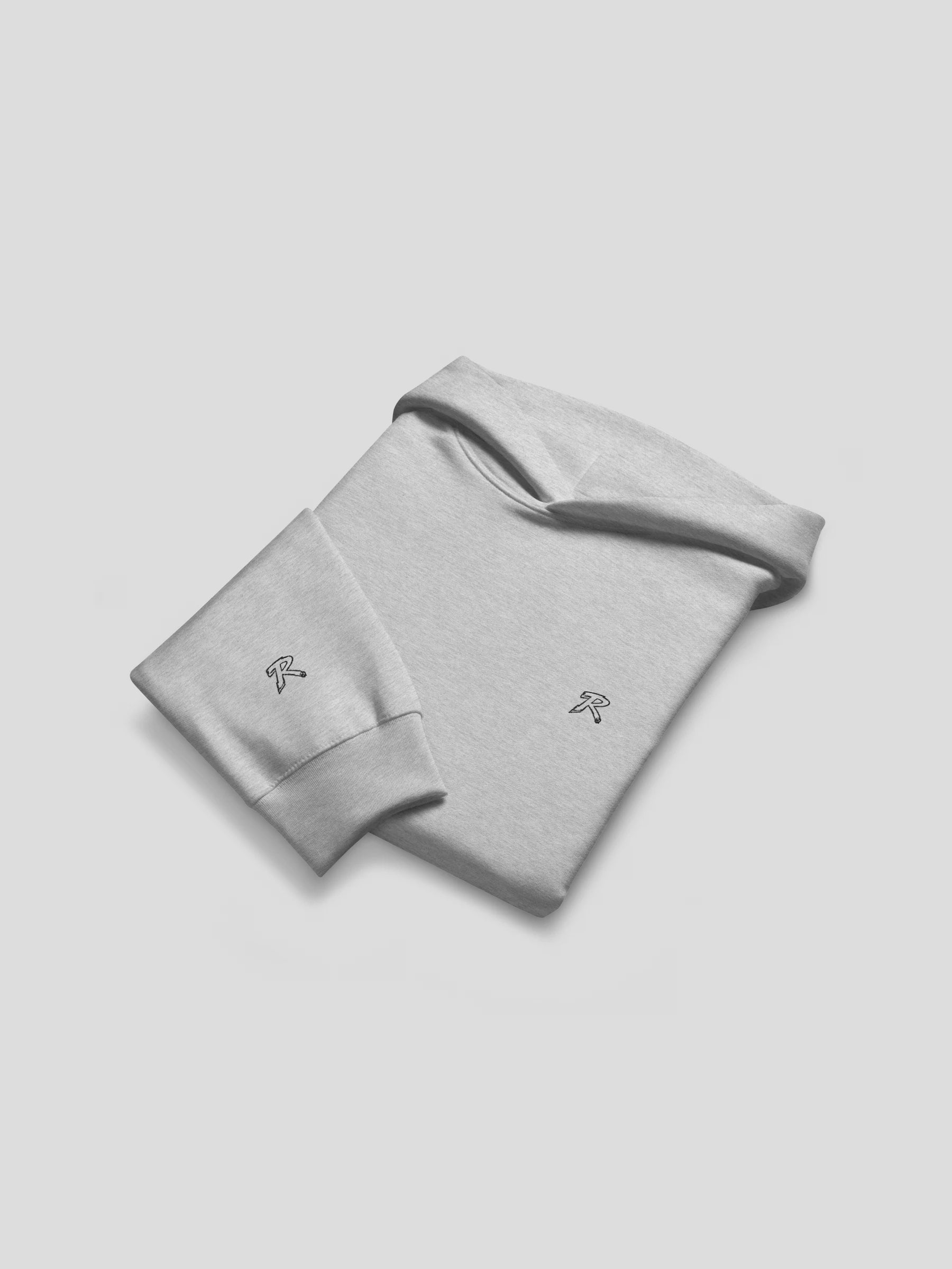Folded flat lay of REMNANT. THEORY.01 Hoodie in COLD Grey – premium heavyweight cotton hoodie with minimalist logo embroidery