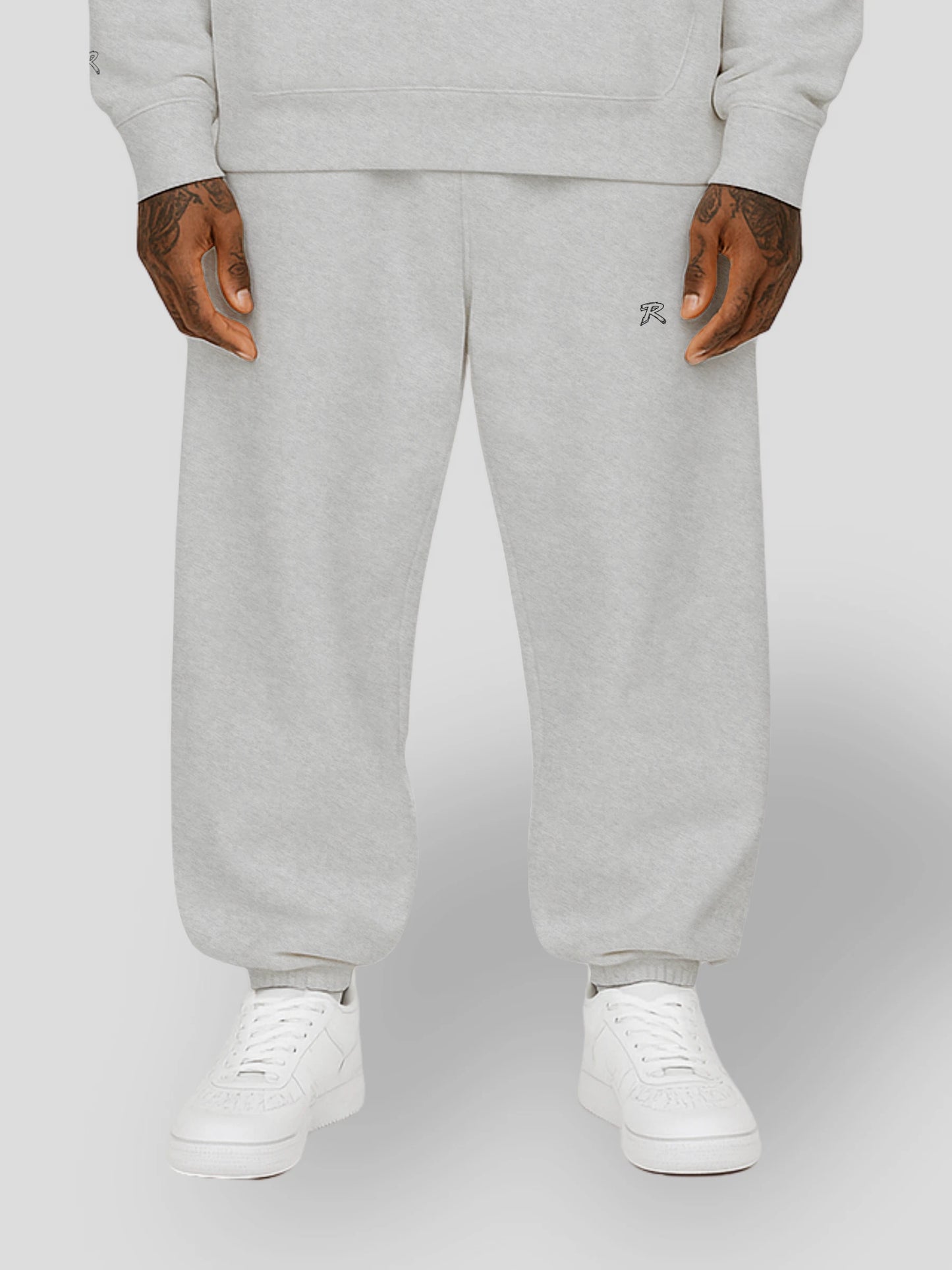 Flat lay of REMNANT. THEORY.01 SWEATS in COLD Grey – minimalist oversized sweatpants made from thick brushed fleece