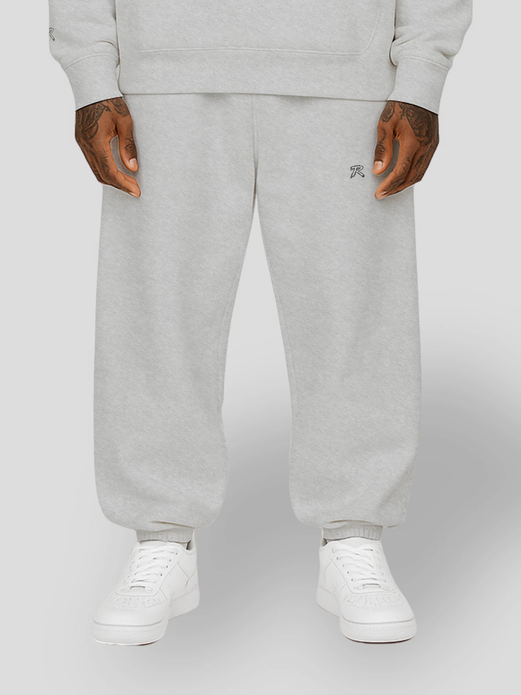 Flat lay of REMNANT. THEORY.01 SWEATS in COLD Grey – minimalist oversized sweatpants made from thick brushed fleece