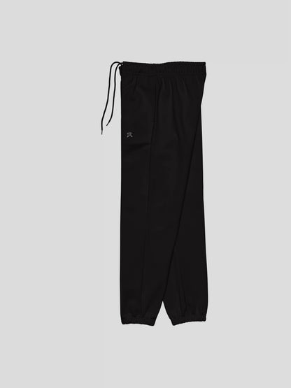 Left side angle of REMNANT. THEORY.01 SWEATS in NOIR Black – thick brushed fleece joggers for modern streetwear outfits