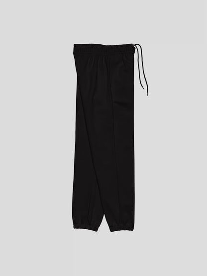 Right side view of REMNANT. THEORY.01 SWEATS in NOIR Black – baggy fit heavyweight joggers with minimalist silhouette