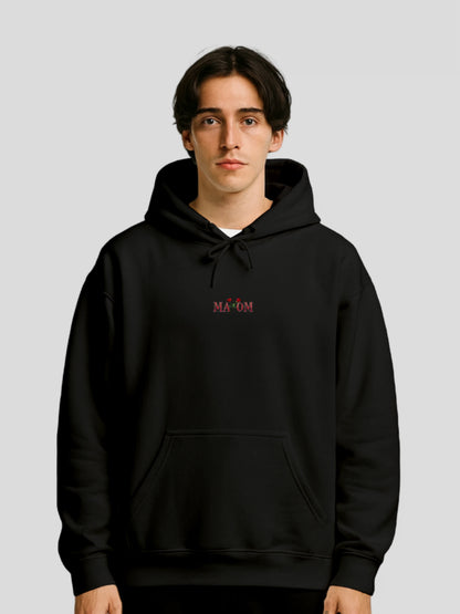 Male model wearing the Black Rose Graphic Streetwear Hoodie by MAXOMclo – black rose graphic hoodie with inspirational quote on back and premium streetwear fit.