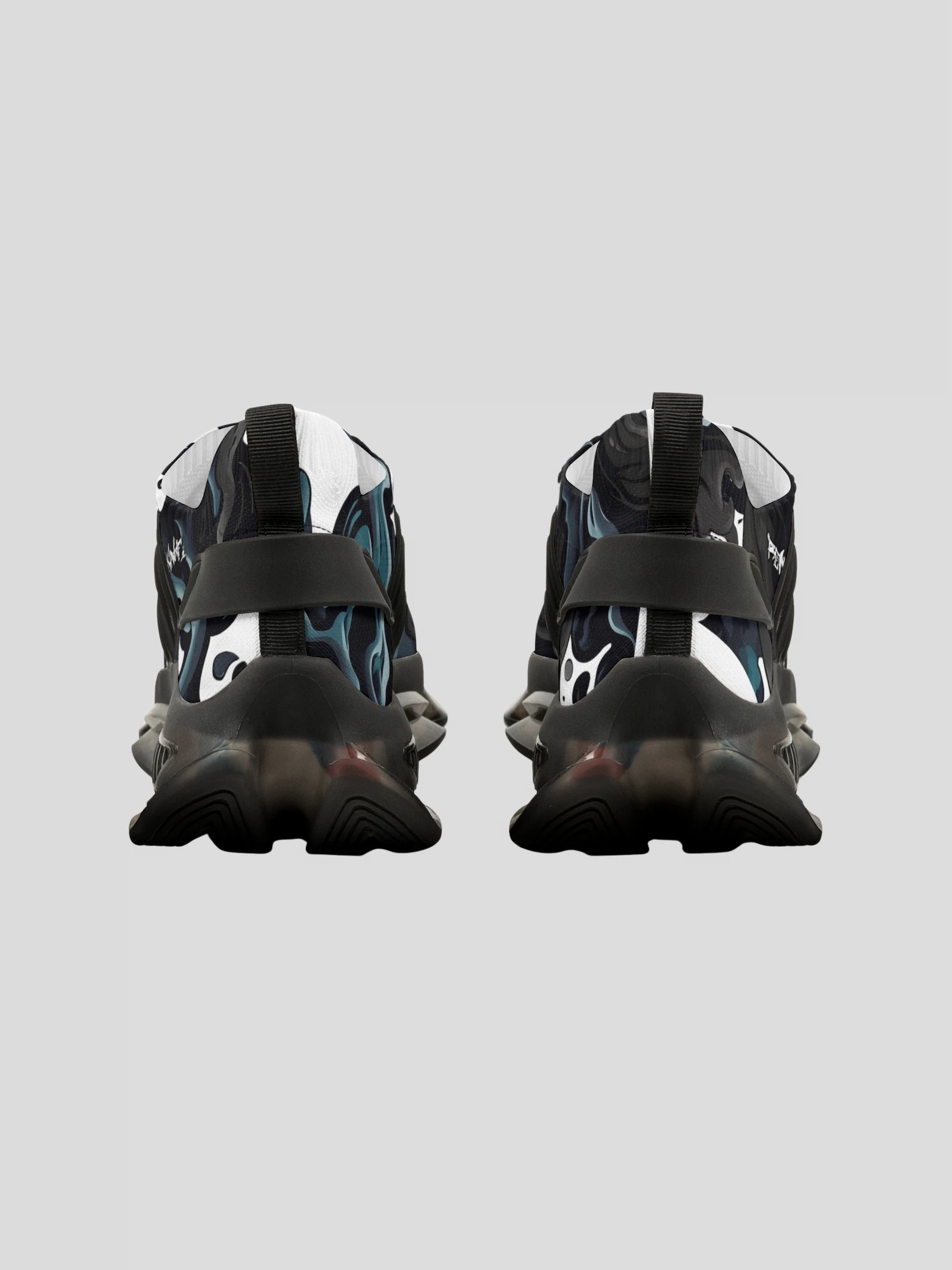 Back angle of WOMENS REMNANT. FRACTURE sneaker with abstract smoke pattern and cushioned EVA heel